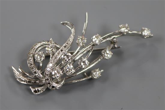 A diamond and white metal (tested as platinum) spray brooch, 58mm.